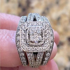 Engagement ring & 2 surrounding wedding bands.